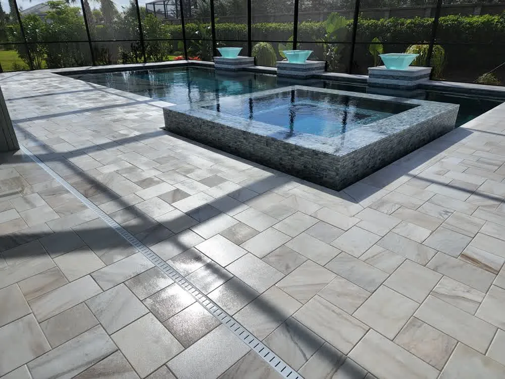 Sealed paver pool deck with a wet look finish